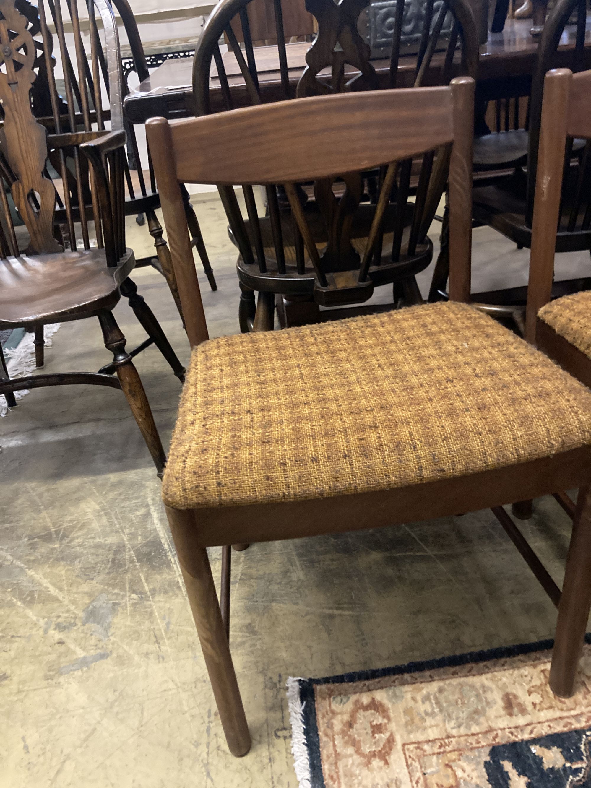 A set of four mid century Macintosh teak dining chairs, model 4003